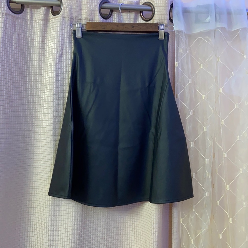 faux leather skirt. Fitted top flowy bottom